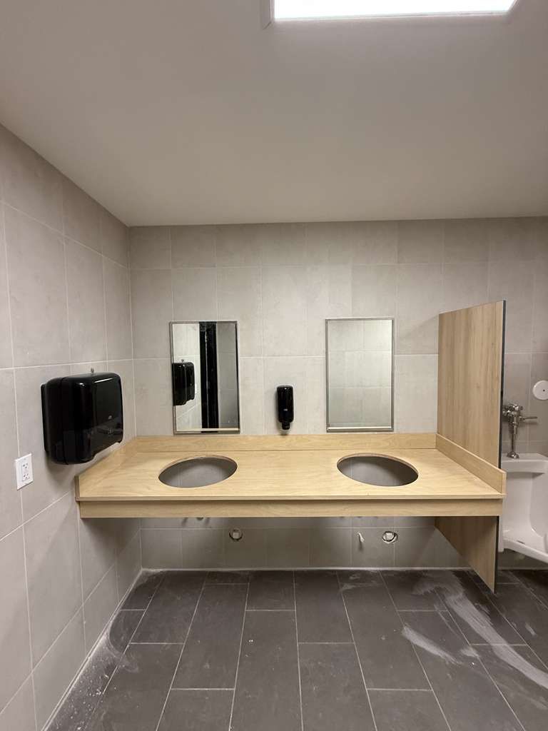 Heavy-duty stainless steel restroom accessories and secure hand dryer installation