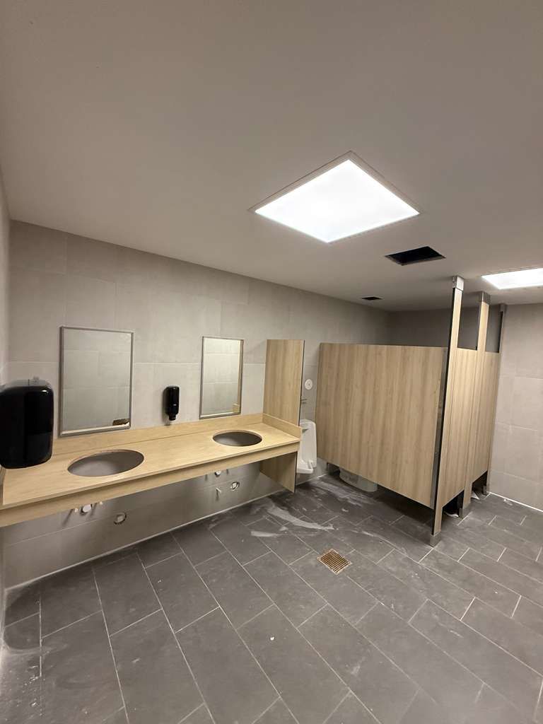 Overview of 22 fully renovated, ADA-compliant restroom stalls at Matter Academy School