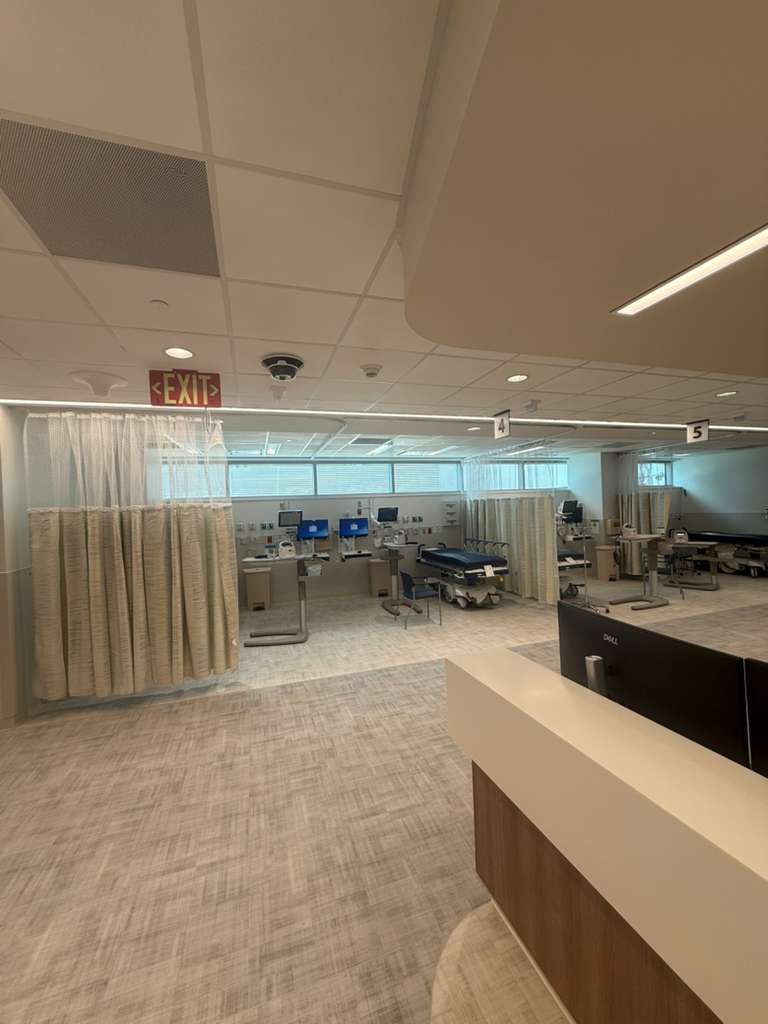 ADA-compliant ergonomic handrails with secure wall brackets in oncology wing
