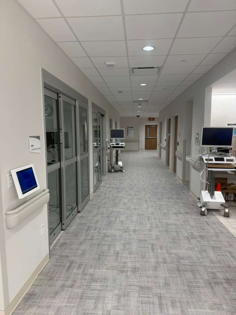 Class A fire-rated wall protection sheets in clinical treatment area