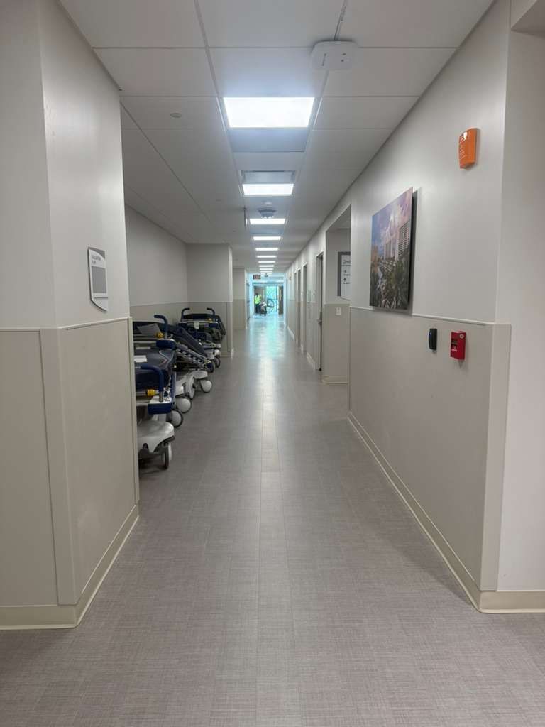 Close-up of ADA ergonomic brackets and handrail end-caps on hospital walls